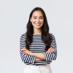 Home lifestyle, people emotions and casual concept. confident nice smiling asian woman cross arms chest confident, ready to help, listening to coworkers, taking part conversation